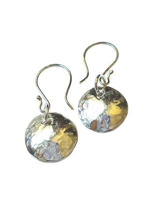 A pair of hammered round silver drop earrings with fishhook wires, displayed on a clean white background.