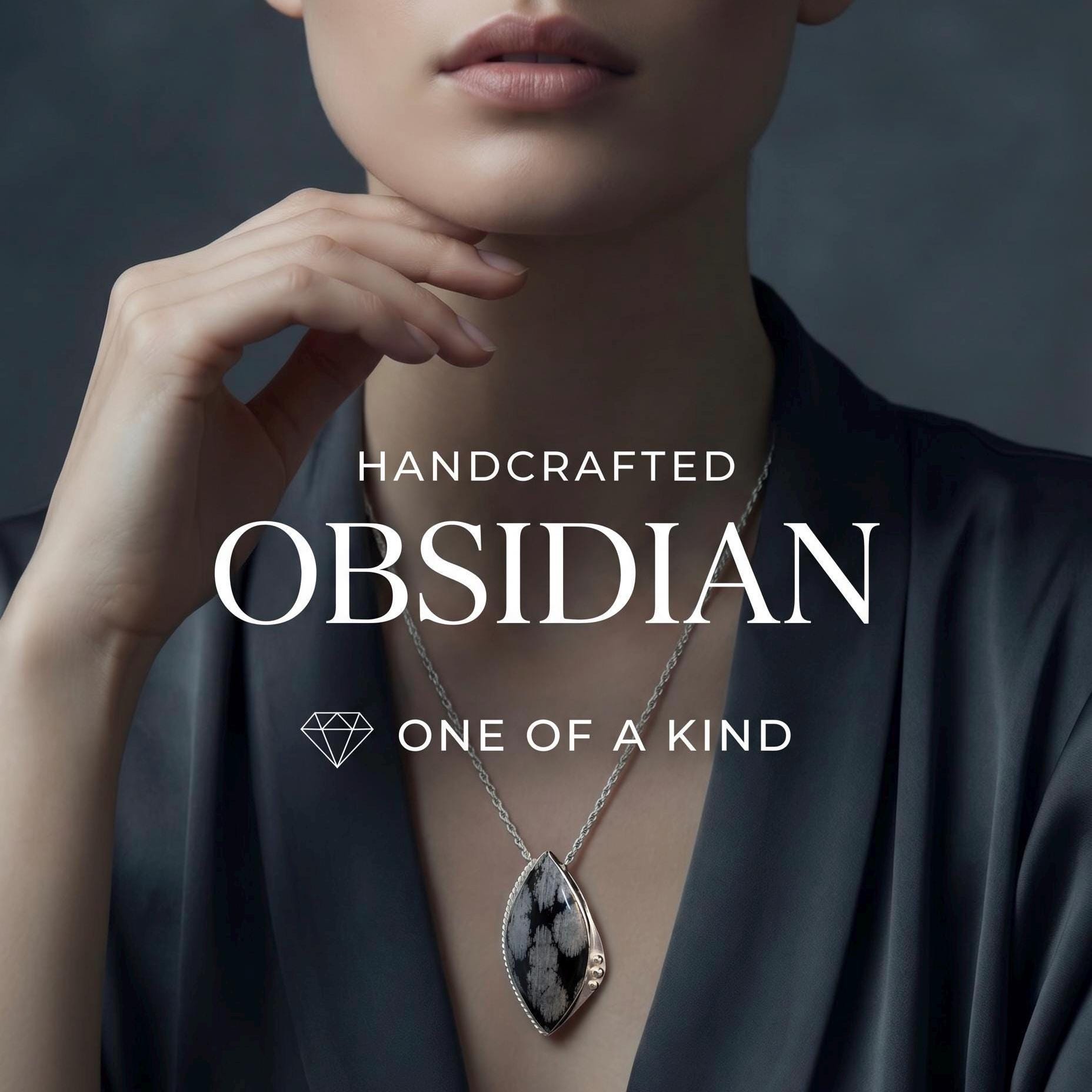 May include: A necklace featuring a marquise-shaped snowflake obsidian pendant set in a silver-toned metal frame, suspended from a delicate silver-toned chain. The text HANDCRAFTED OBSIDIAN ONE OF A KIND and a diamond icon are overlaid on the image.